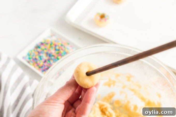 Authentic Mexican Sweet Treats 5 Inserting a wooden skewer into a sugar cookie dough ball to form a ring