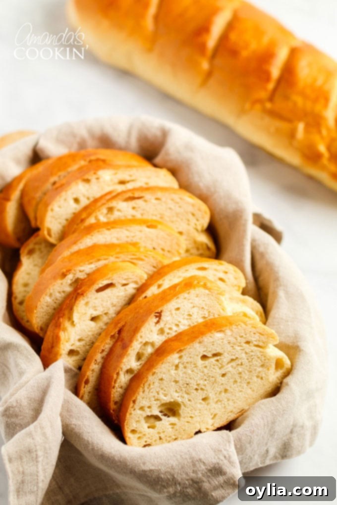 Basket filled with perfectly sliced homemade Italian bread, ready to be served or enjoyed with a meal.