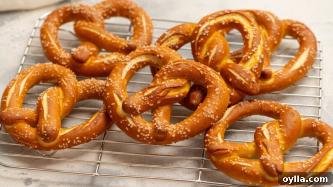 Bake Your Own German Pretzels 6 A stack of perfectly golden-brown homemade German pretzels, hot out of the oven, ready to be enjoyed.