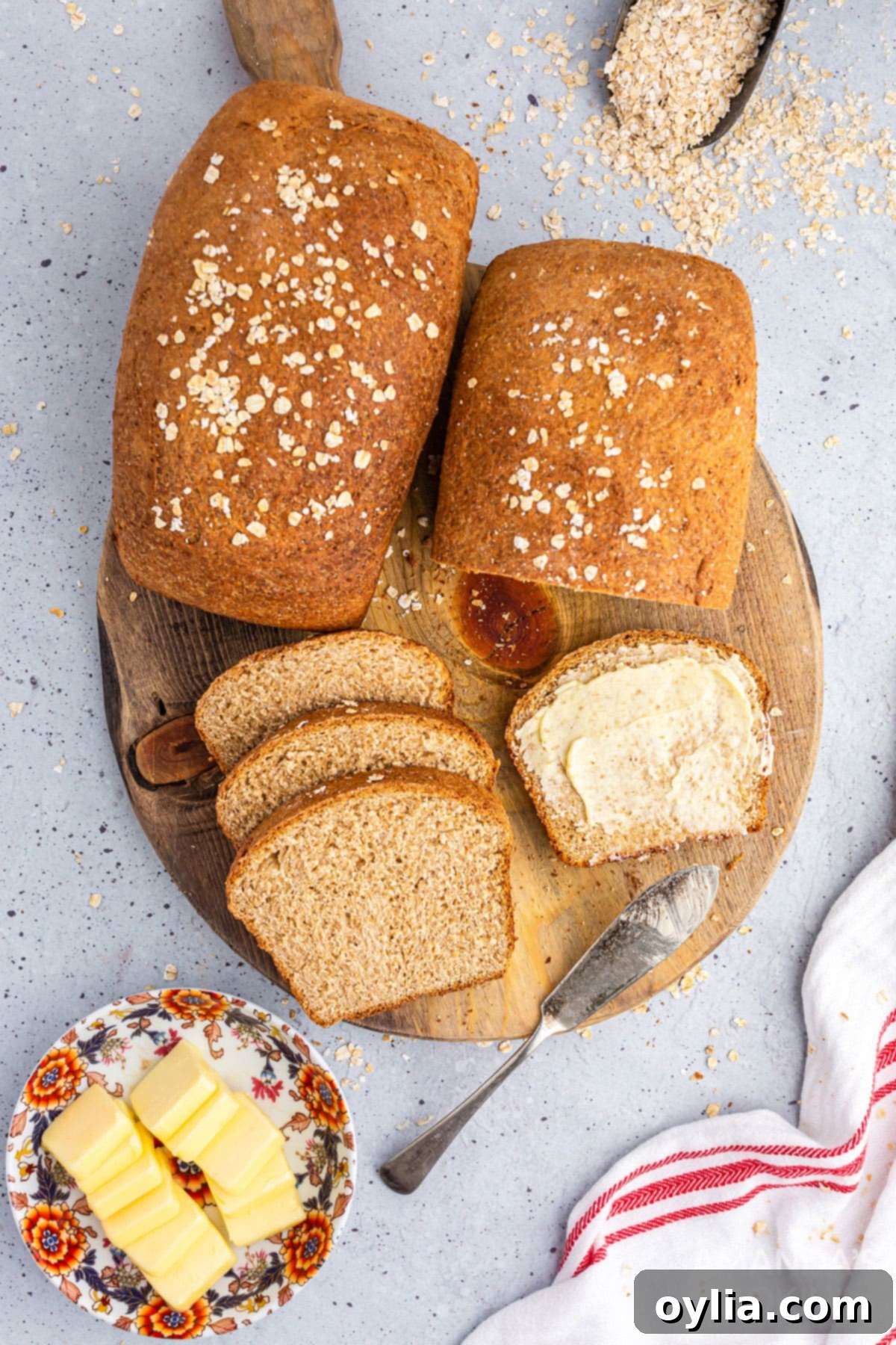 2 loaves of multigrain bread on a wooden board