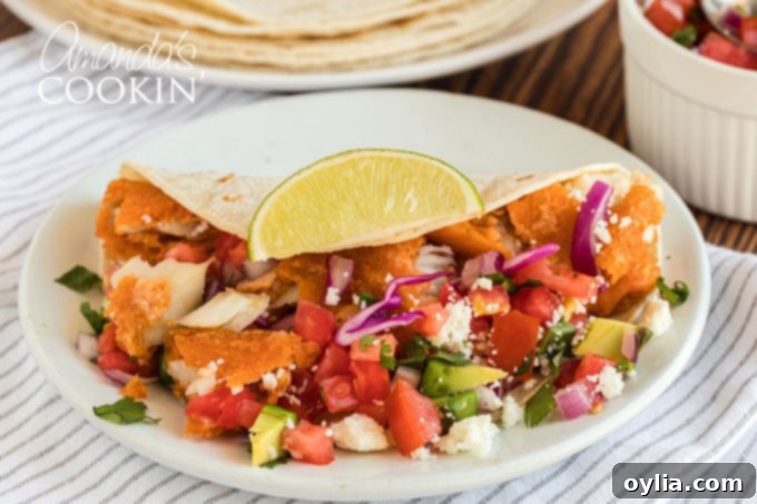 fish taco with toppings on plate