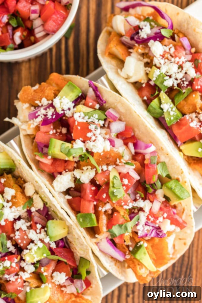 overhead view of fish tacos with toppings