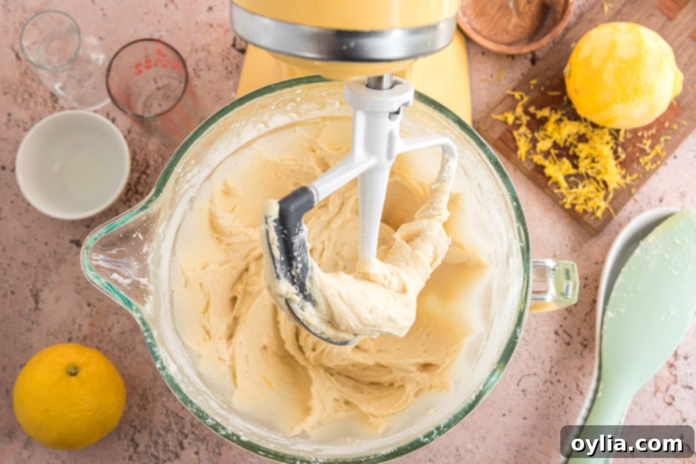 The finished sticky lemon drop cookie dough in a stainless steel mixer bowl, showcasing its unique consistency.