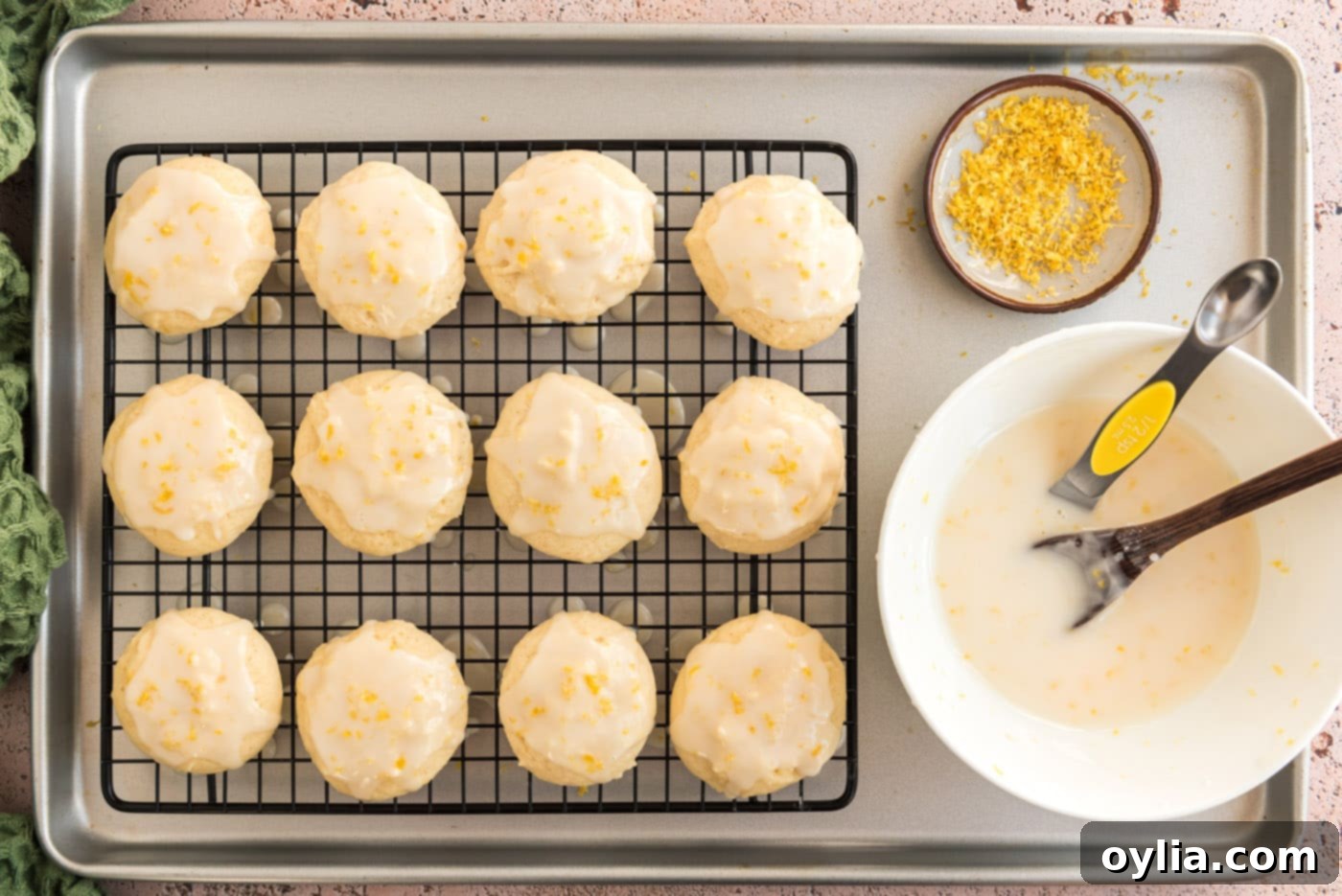 Beautifully glazed Lemon Drop Cookies, with a smooth, bright yellow topping, arranged and ready to be served.