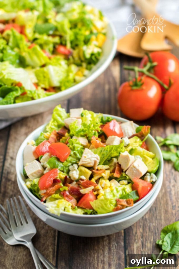 Close up photo of a prepared Cobb Salad in a bowl, ready to be served