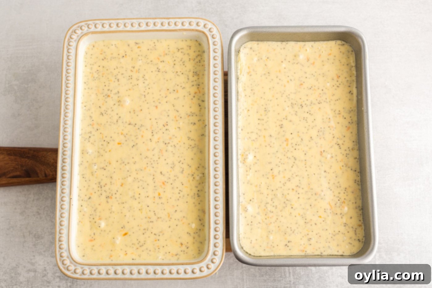 loaf pans with orange poppy seed pound cake batter, ready for the oven