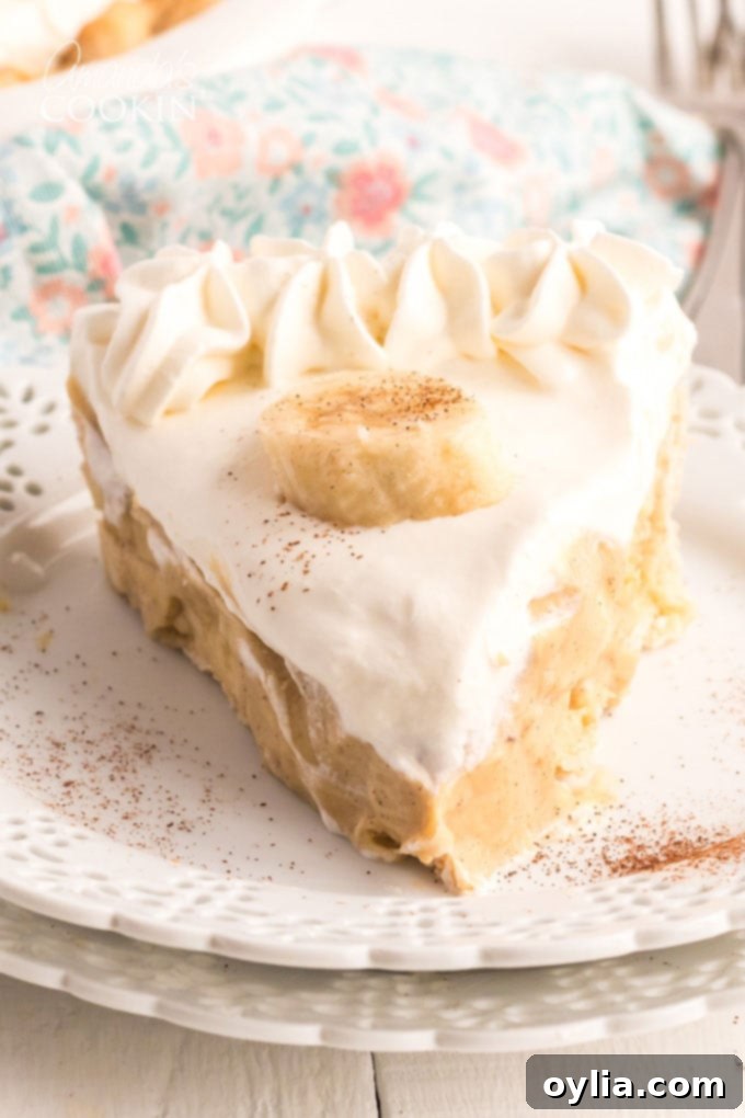 slice of banana cream pie on a white plate