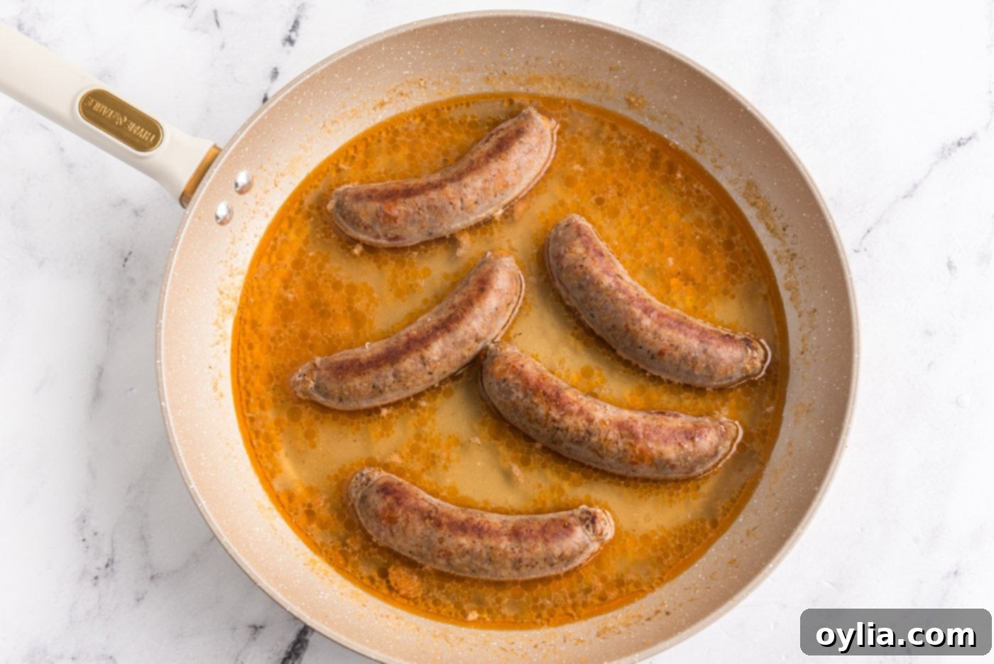water added to skillet with Italian sausage