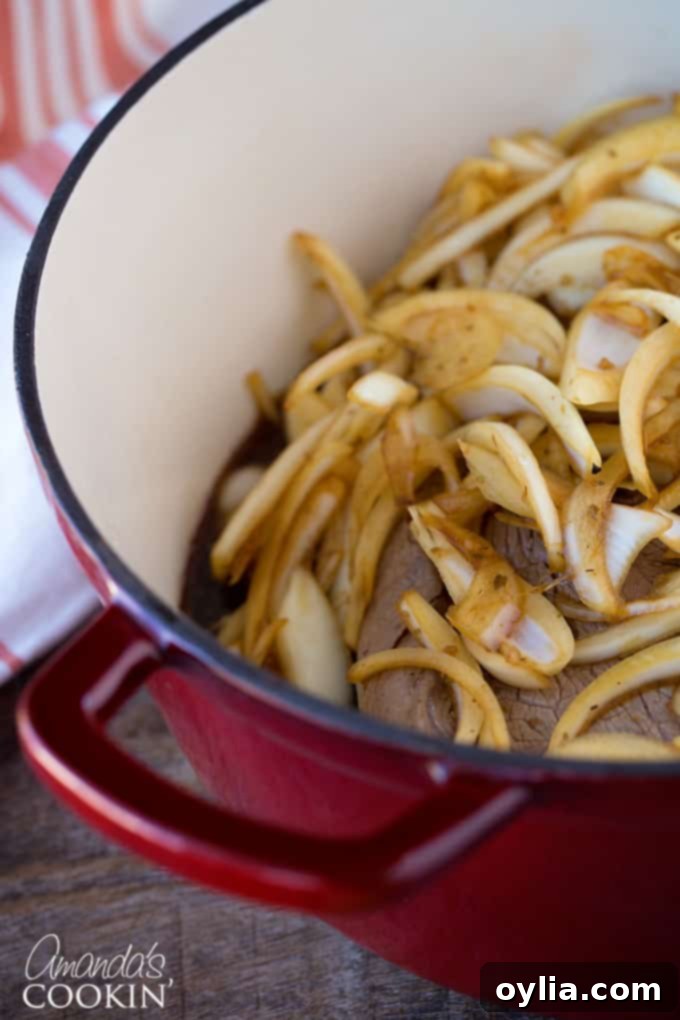 Place onions on top of the roast and into the sauce in the pan for added flavor.