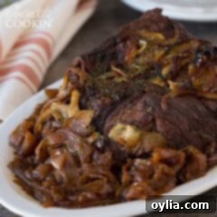 Amish pot roast with onions on a platter, ready to be served.