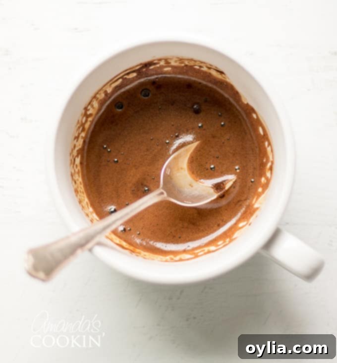Velvet Tiramisu Dream 6 A small cup of prepared espresso extract, ready for use.