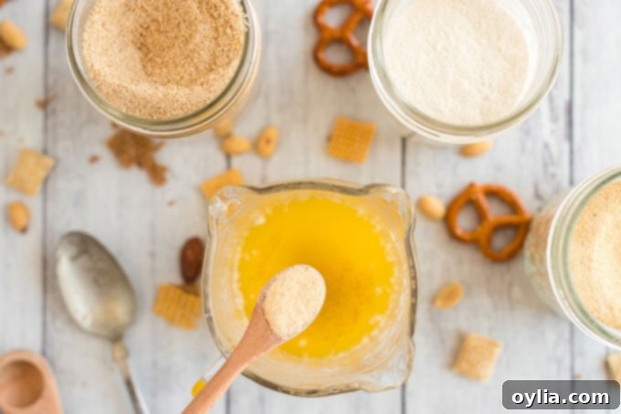 garlic powder in a spoon over melted butter