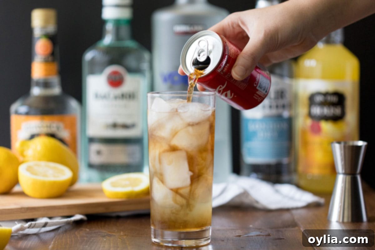 adding cola to a long island iced tea