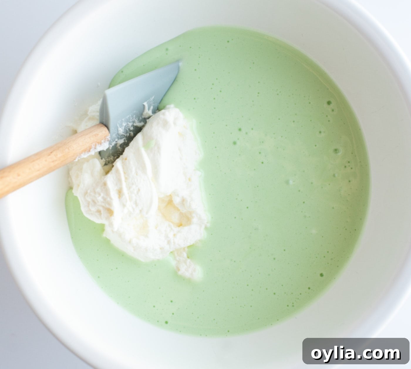 green food coloring and pepper mint extract mixed with marshmallow mixture