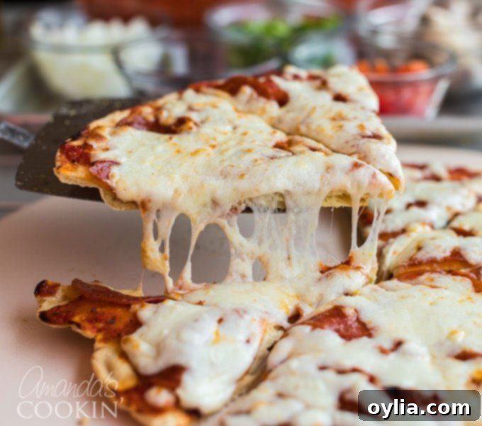 pizza slice being lifted from table with pie server