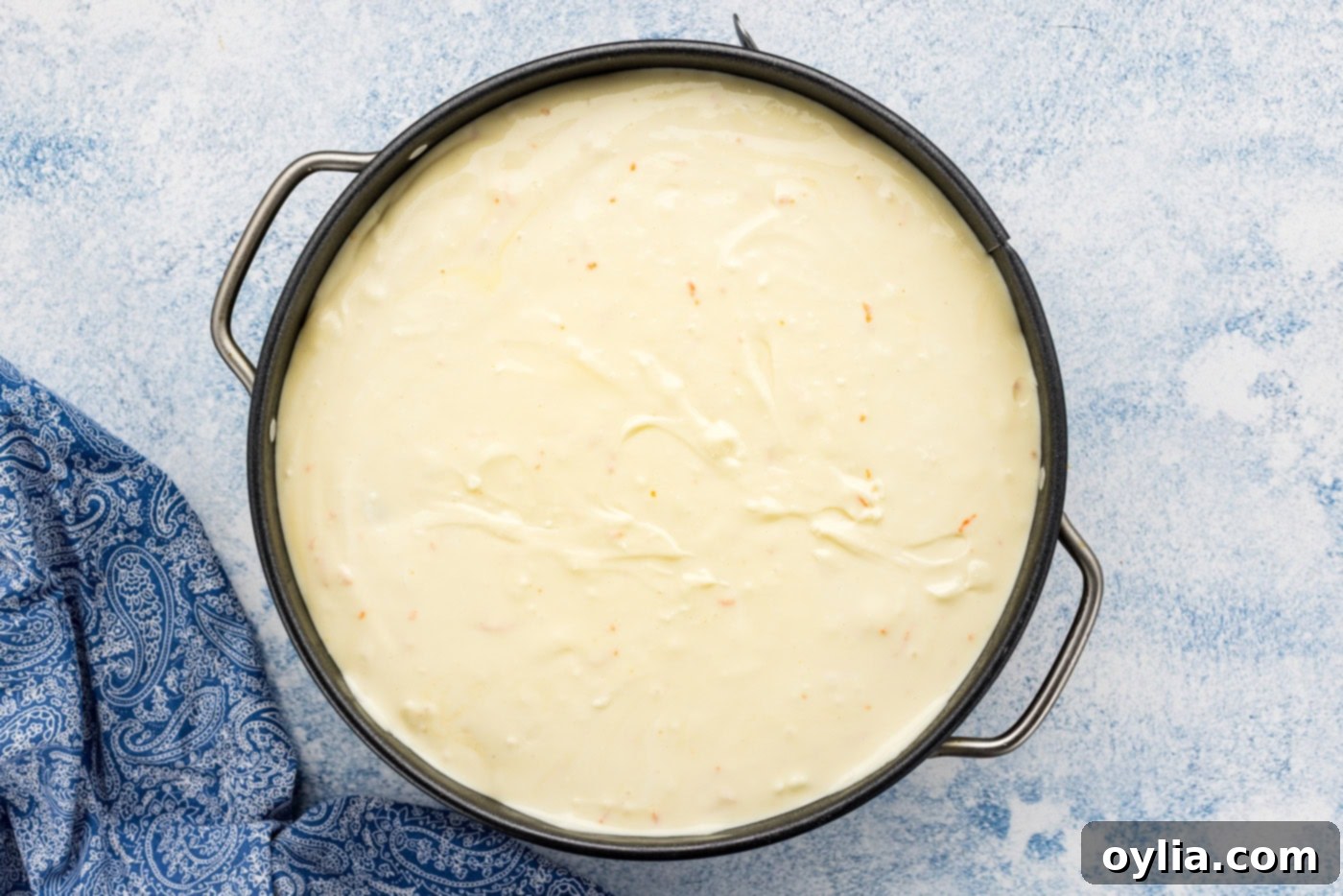 Mandarin orange cheesecake batter in a pan