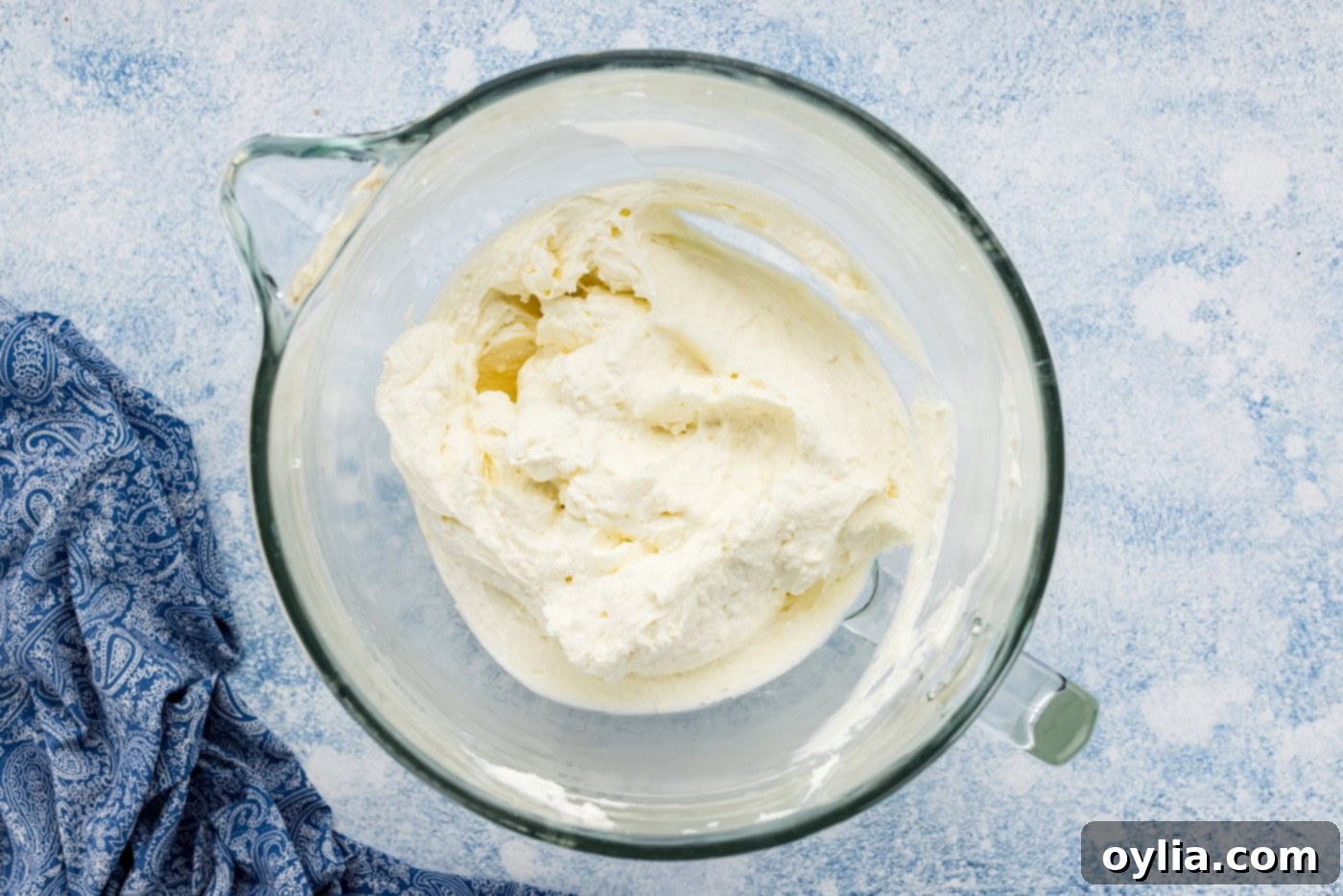 cream cheese, butter, and sugar mixture in a bowl of a stand mixer