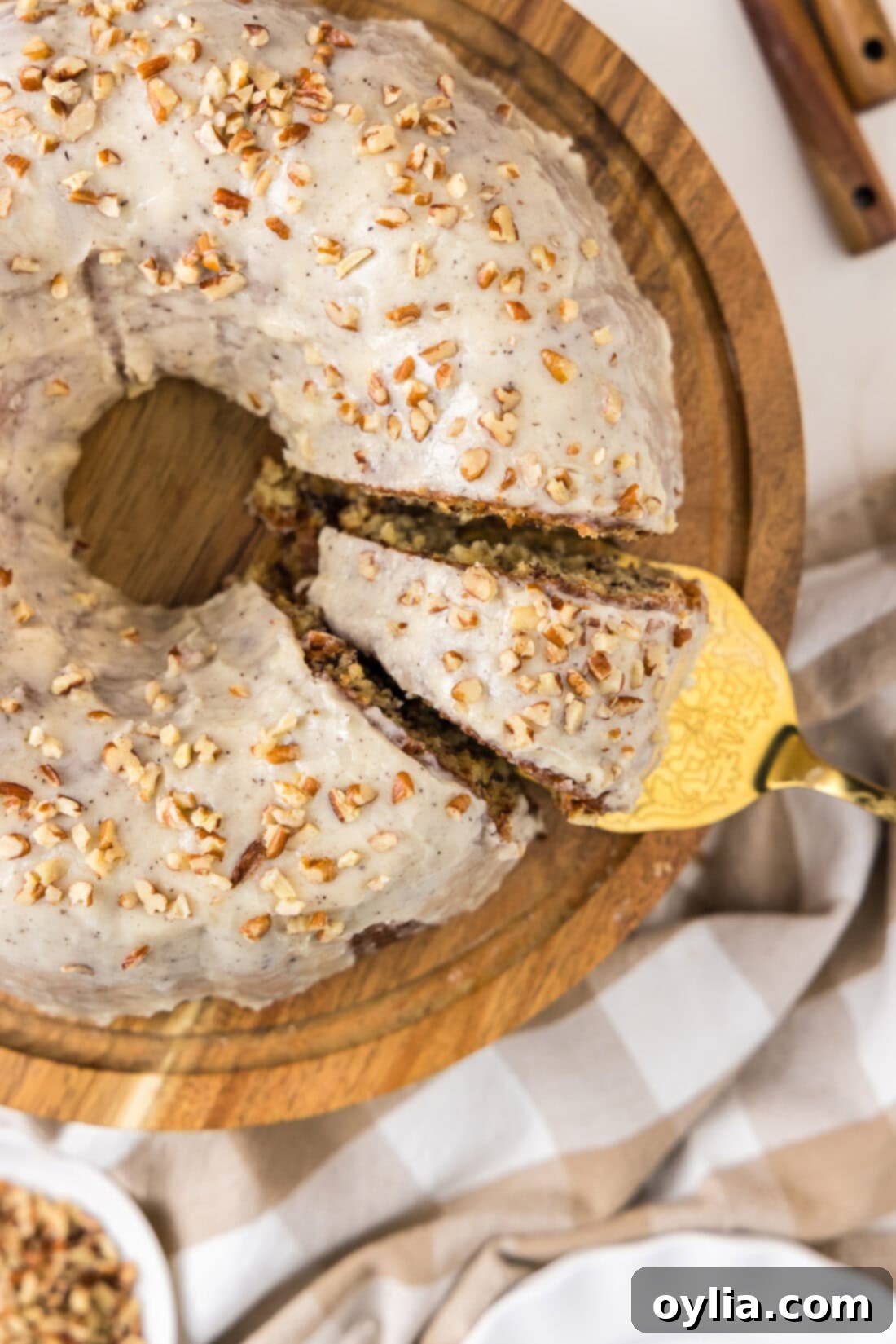 Overhead photo of a Banana Bundt Cake with a slice being removed