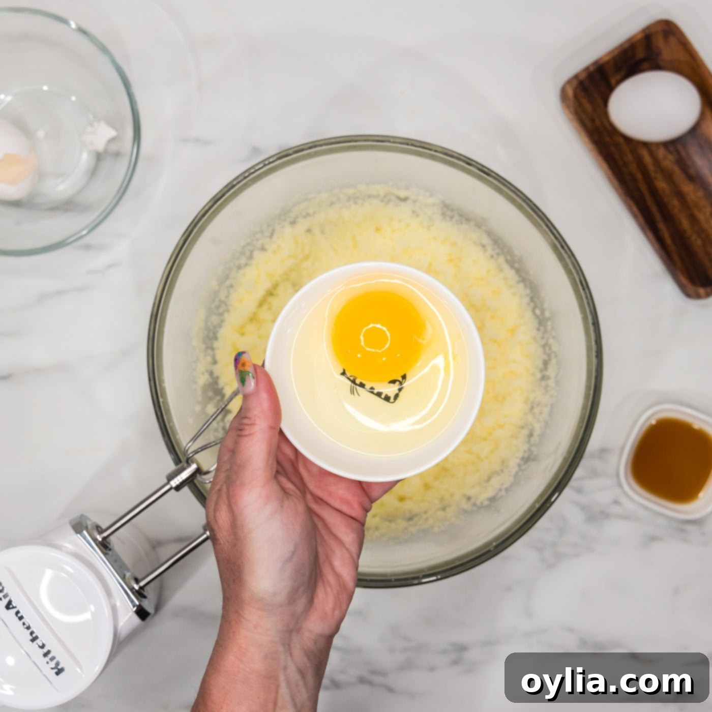 adding eggs to bundt cake batter