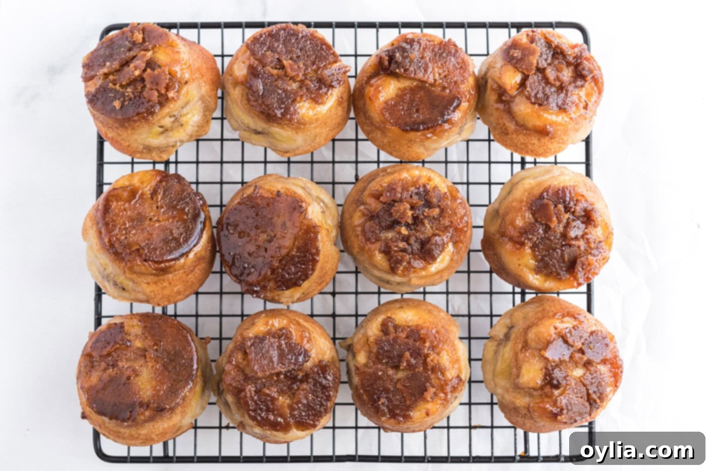 banana upside down muffins on a cooling rack