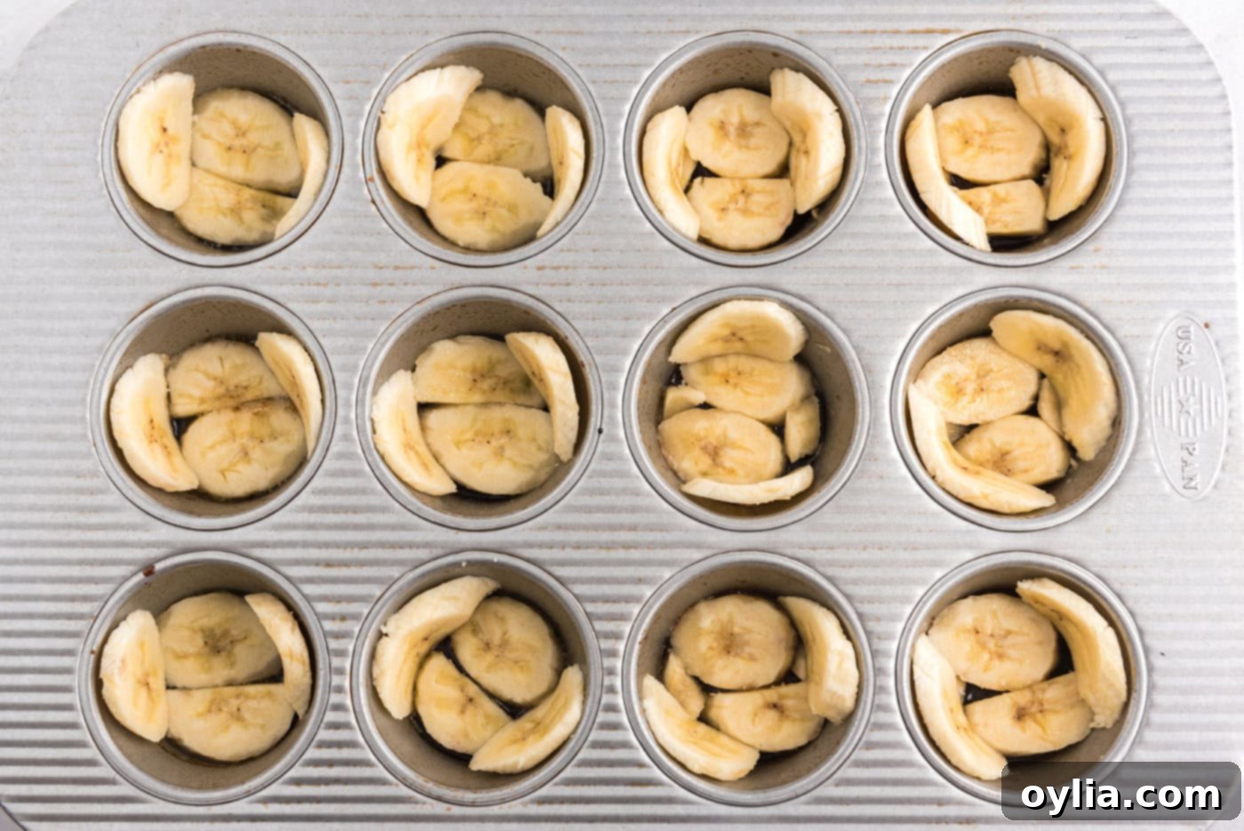 banana sliced in a muffin pan
