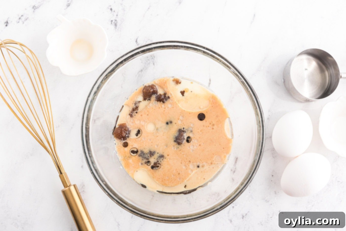 Caramelized Banana Muffins 9 brown sugar, oil, milk, and rum in a bowl