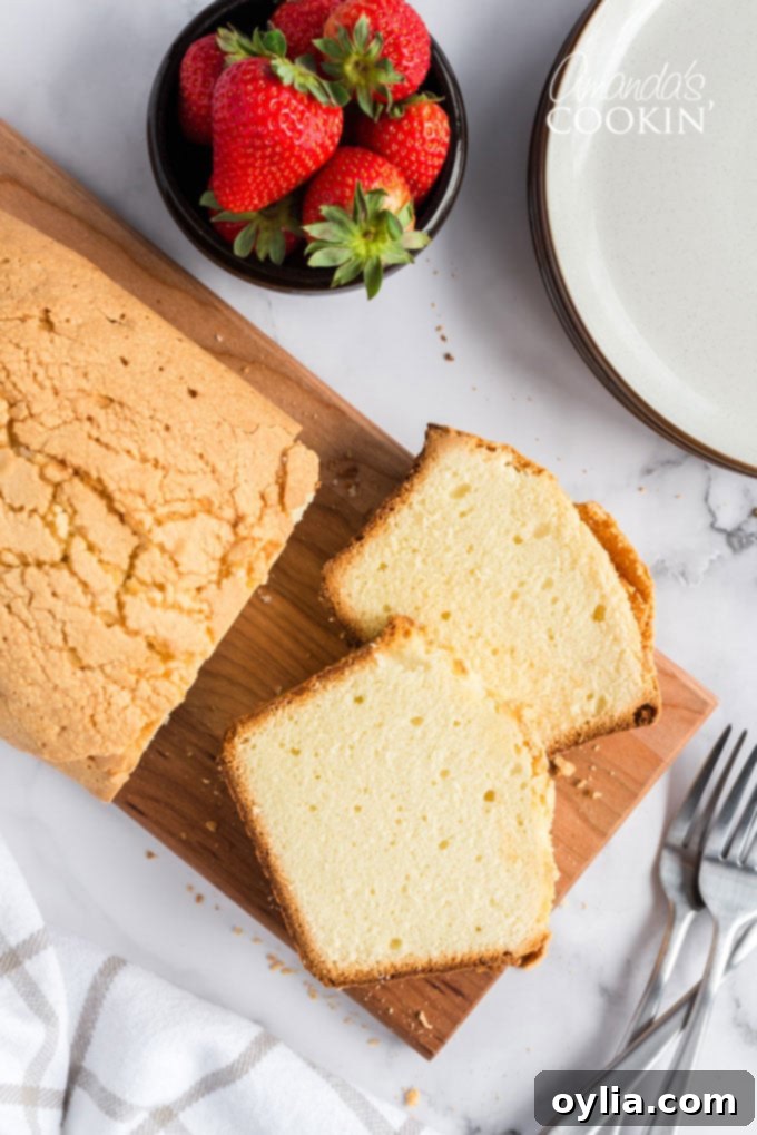 overhead view of sliced pound cake on cutting board
