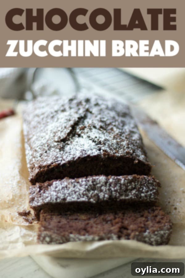 This chocolate zucchini bread is moist, chocolatey and every bit of delicious. It's a nice treat to bring to coworkers, neighbors, or to enjoy yourself. #chocolate #zucchinibread #quickbread #bread Chocolate Zucchini Bread pin image