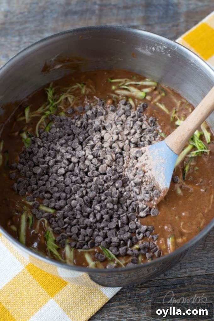 All ingredients for chocolate zucchini bread mixed in a bowl