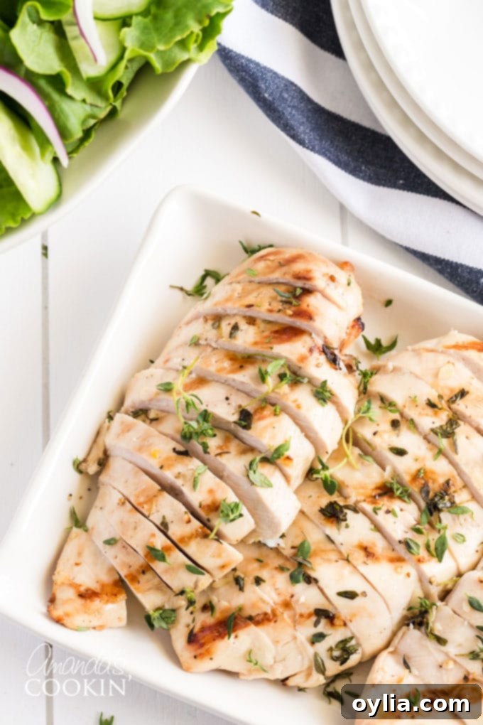 sliced grilled chicken breasts on a platter