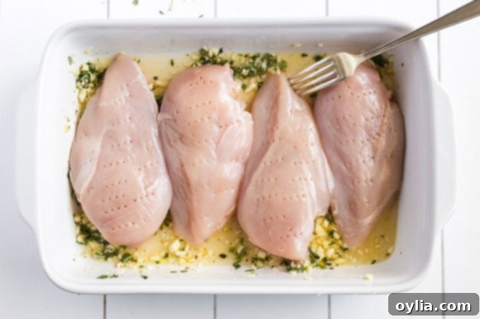 chicken breasts that have been pierced with a fork