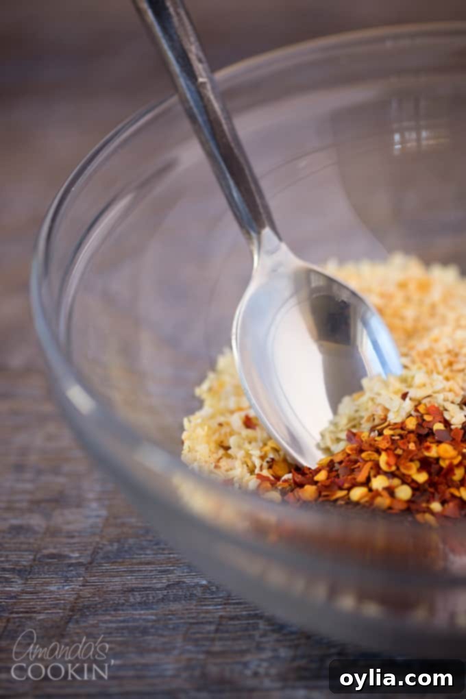 Measuring out homemade chili seasoning ingredients