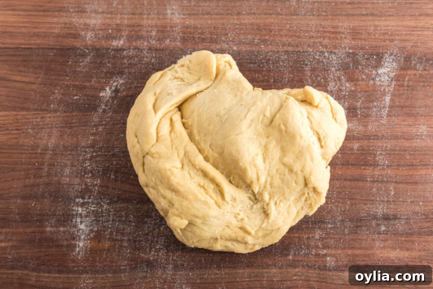 kneading yeast dough on cutting board