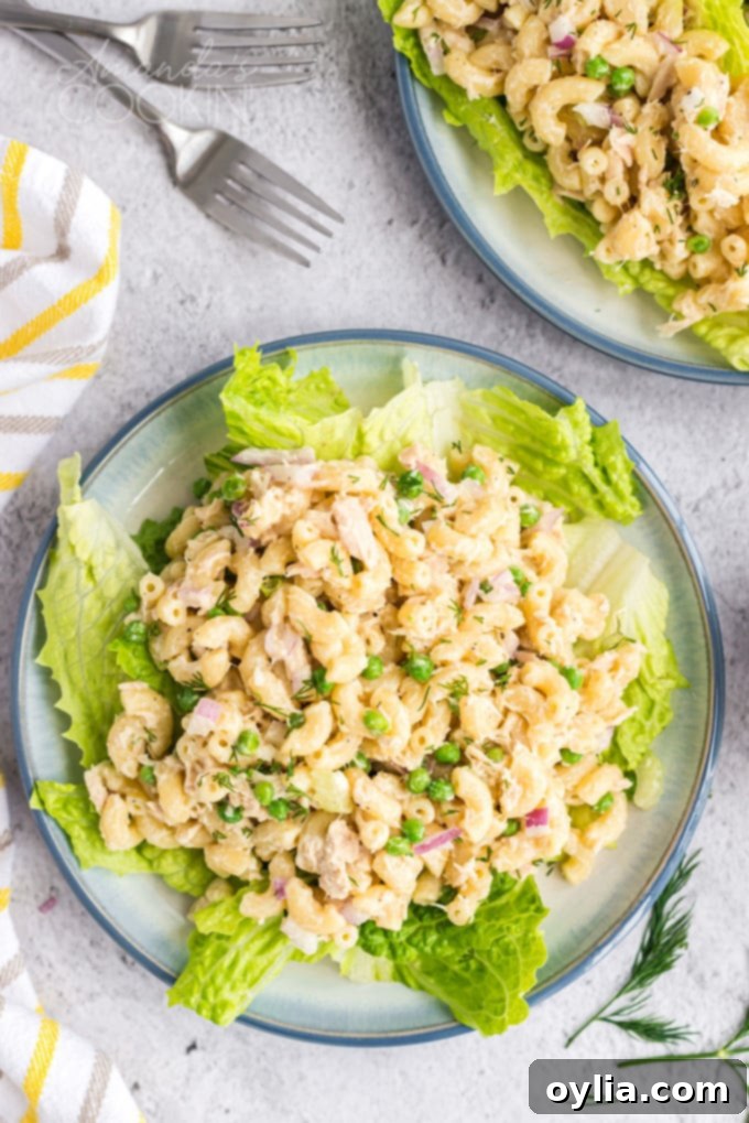 This easy tuna pasta salad recipe is perfect for potlucks and barbecues, offering a protein-packed and satisfying lunch! Made with elbow macaroni, tuna, celery, onion, and a mayonnaise-lemon dressing. Delicious tuna pasta salad served on a bed of fresh lettuce
