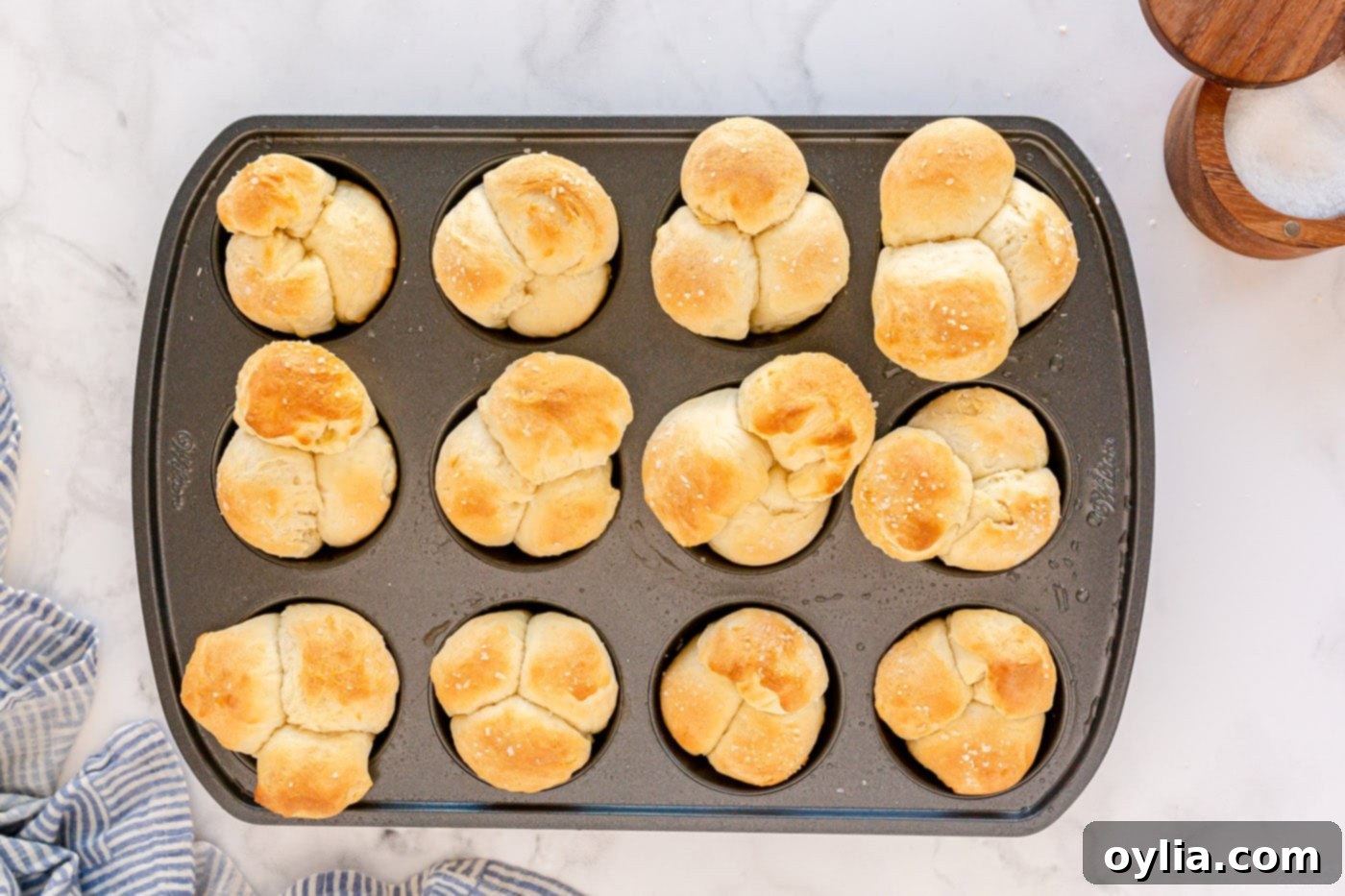 golden brown dinner rolls in pan