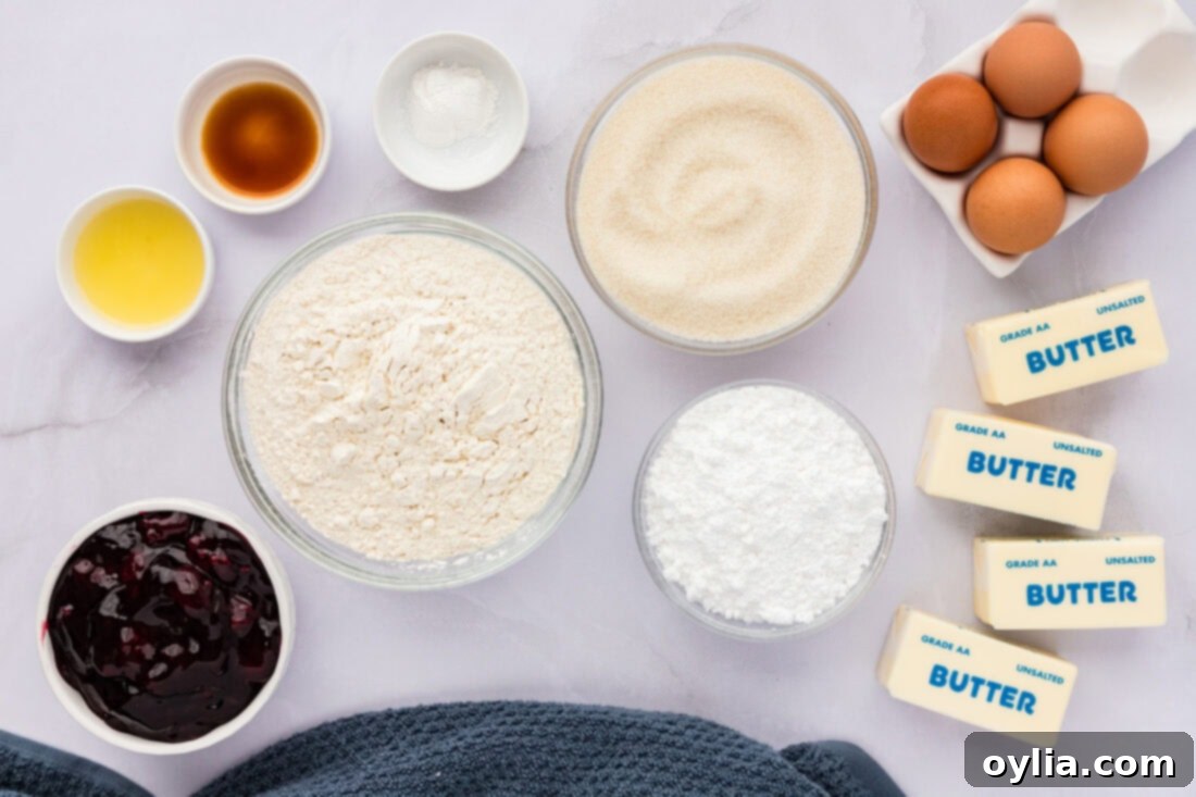 Various ingredients for Blackberry Pie Squares laid out on a white surface