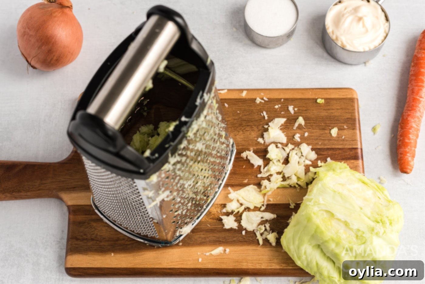 Finely grating green cabbage in a food processor for KFC coleslaw.