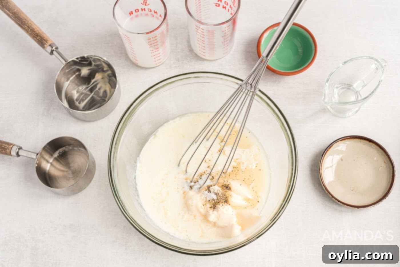 Whisking together the creamy, tangy dressing ingredients for homemade KFC coleslaw.