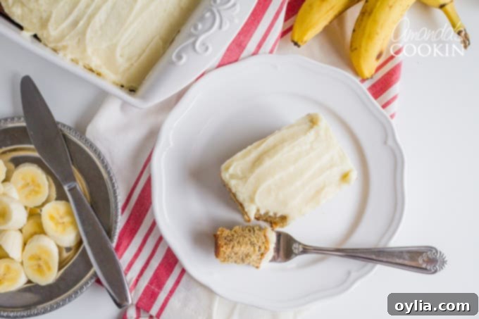 A plate of Banana cake with a fork, ready to eat