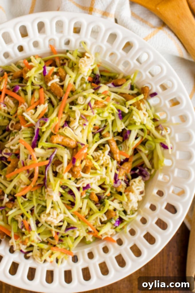 Large serving bowl of vibrant Asian Broccoli Slaw, ready to be enjoyed as a refreshing crunchy side dish.