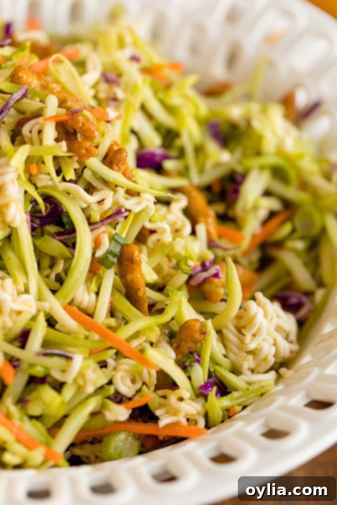 A close-up view of the vibrant and crunchy Asian Broccoli Slaw, highlighting its fresh textures and delicious appeal.