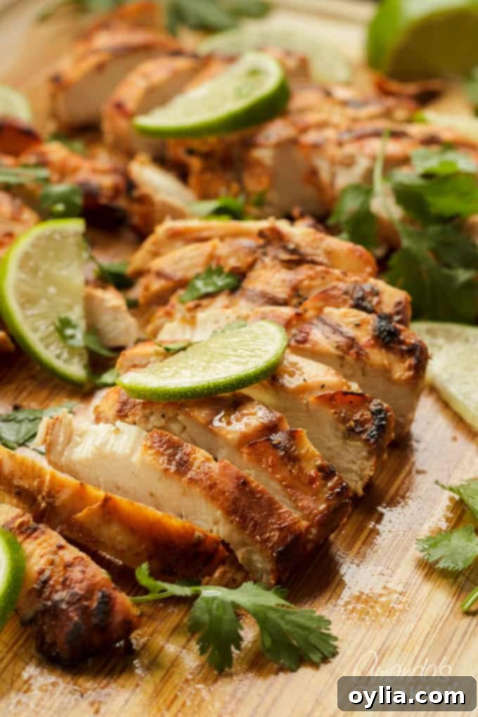 Delicious Grilled Chile Lime Chicken with fresh lime wedges, ready to serve.