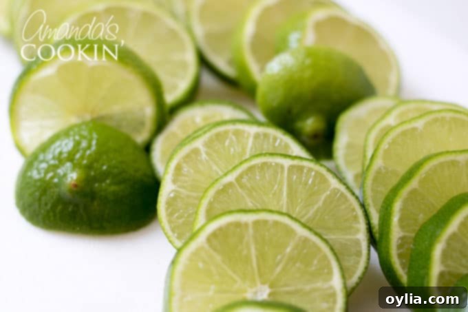 Step-by-step: Slice fresh limes into uniform rounds.