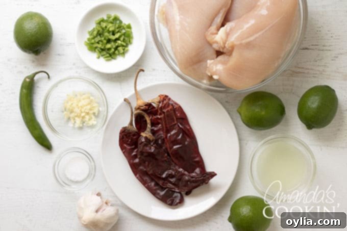 Dried red chiles, fresh limes, and garlic cloves, key ingredients for the chile lime marinade.