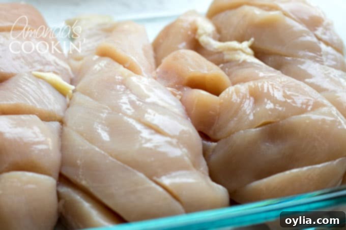 Step-by-step: Cut diagonal slits into chicken breasts for better marinade absorption.