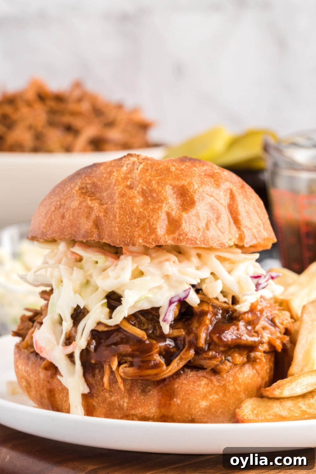 Easy Slow Cooker Pulled Pork 2 Slow Cooker Pulled Pork sandwich with creamy coleslaw