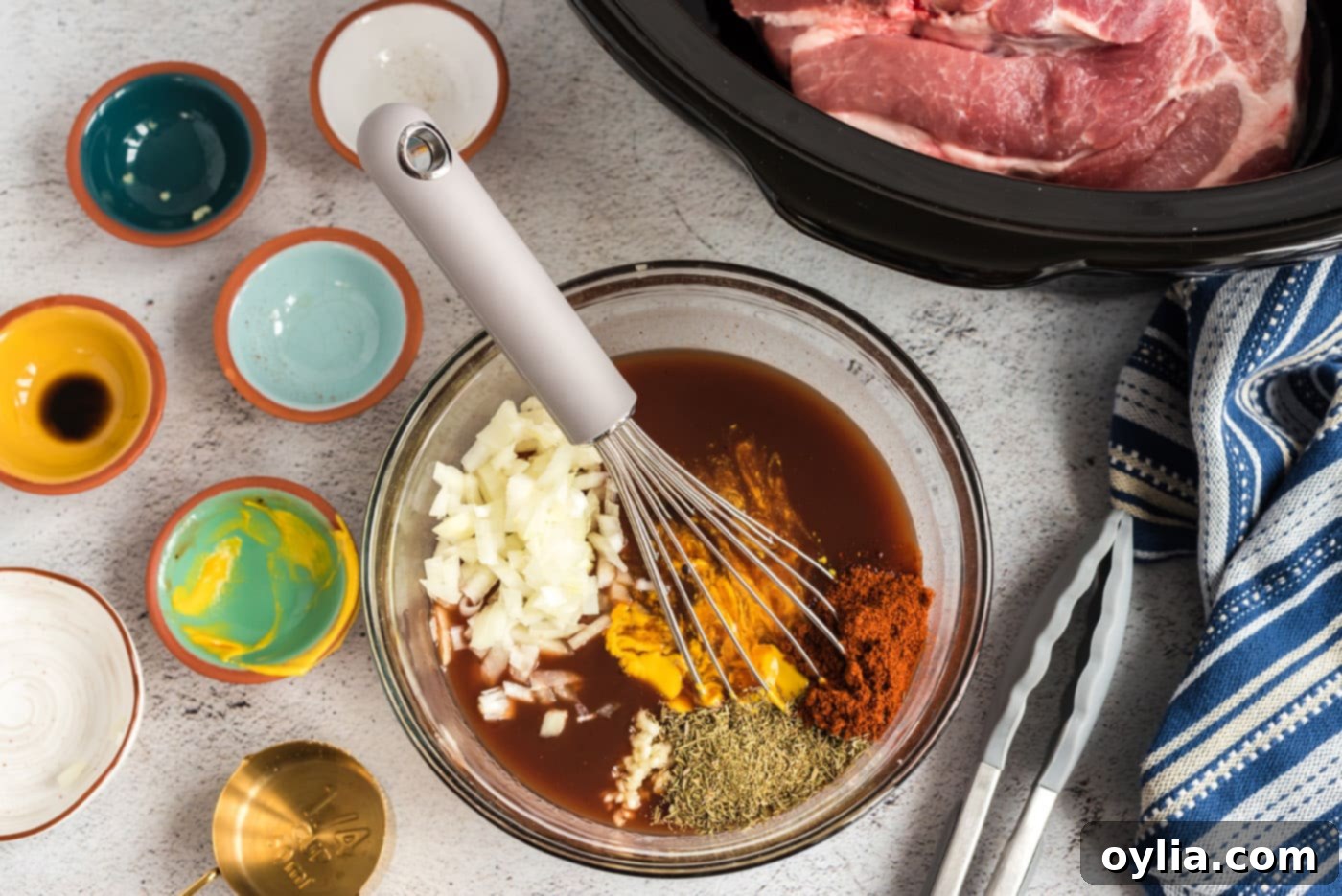 Easy Slow Cooker Pulled Pork 6 Mixing sauce and seasonings for slow cooker pulled pork