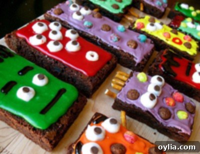 Cute green monster brownie with two Cheerio eyes and a playful red smile