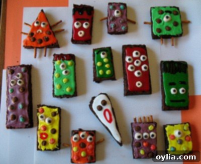 A collection of decorated monster brownies with various cereal and icing designs