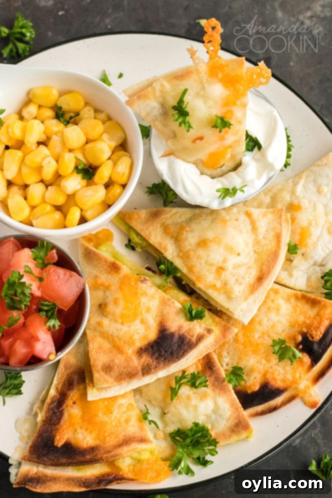 Platter of sliced Quesados, a Mexican appetizer, with an optional small bowl of sour cream and spoon